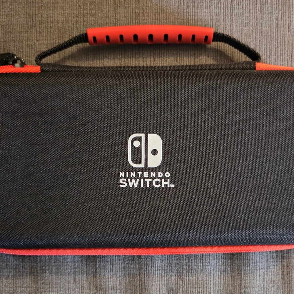 Official Nintendo Switch Red and Black Carrying Case With Microfiber Cloth.